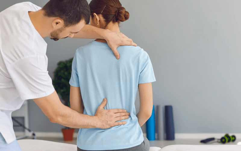 Man receiving chiropractic back pain care