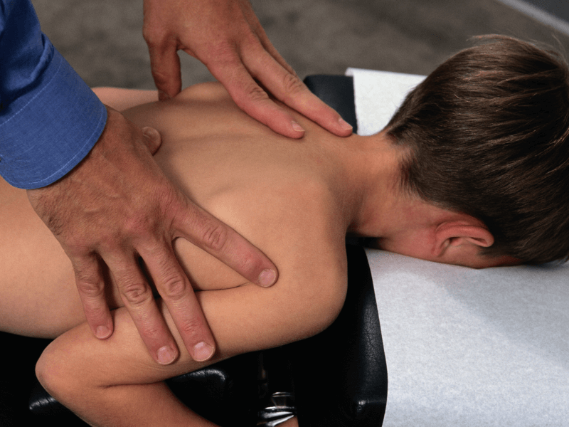 Child receiving pediatric chiropractic care