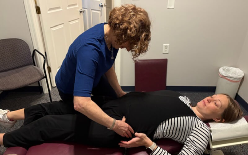 Dr. Honi providing prenatal chiropractic care for pregnant patients